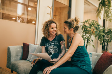 Two yogis discussing a paper 