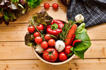 Top view, fresh vegetables in basket on wooden background. Healthy lifestyle, organic food concept. Farmers Vegetable Market, vegetarian, close up