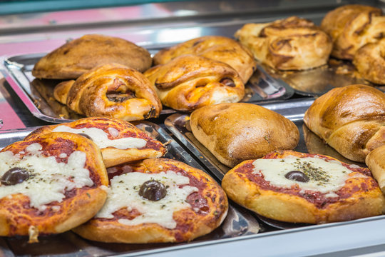 Sicilian "Cartocciata", a typical street food from Sicily. Made with ham, tomato and cheese.