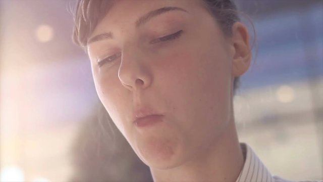 Portrait of a young woman eating food.