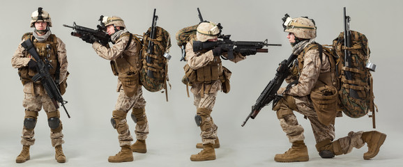 Soldier in camouflage holding rifle