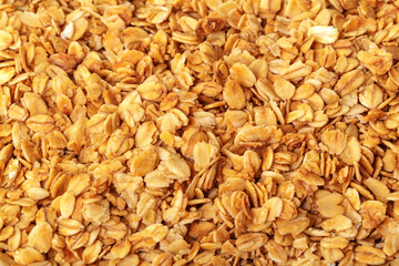 Homemade roasted granola on baking sheet breakfast food background
