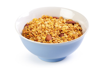 Bowl of whole grain muesli isolated on white background