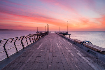 Sunrise over the Lorne Jetty on the Great Ocean Road in Victoria Australia on 22nd June 2010