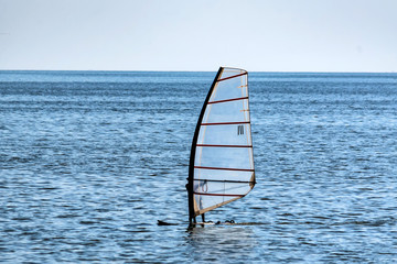 Lonely windsurfer in the sea