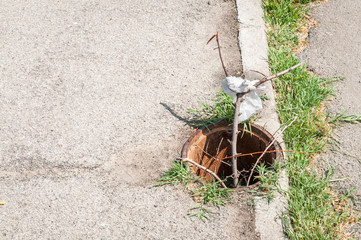 Dangerous open manhole on the pedestrians walkway or sidewalk