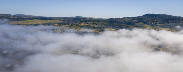 Aerial drone view of a foggy morning in the Scenic Rim, Queensland, Australia