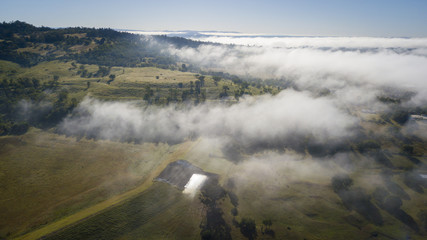Aerial drone view of a foggy morning in the Scenic Rim, Queensland, Australia