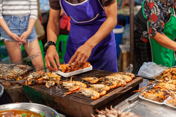 Man prepare prawns for sale