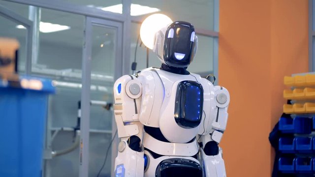 Cheerful robot Is bending its body forwards