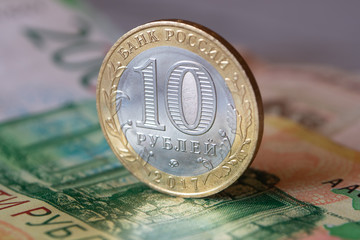 Russian commemorative coin ten rubles on a banknote.