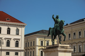 Fototapeta na wymiar Statue of Maximilian at Wittelsbacherplatz and Ludwig Ferdinand Palace in Munich Bavaria Germany Europe travel destinations