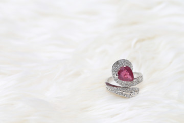 pink gemstone on diamond ring