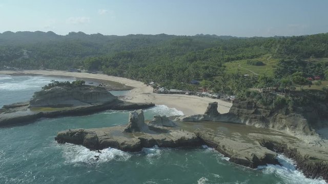 Rock tower of Klayar beach, East Java, Indonesia. Aerial footage in 4K, ungraded, RAW format