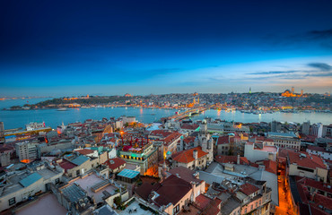 Long exposure panoramic cityscape of Istanbul at a beautiful dramatic clouds sunset from Galata to Golden Horn gulf. View of the wonderful romantic old town at Sea of Marmara. Istanbul. Turkey.