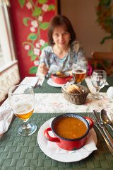 Kosice, Slovakia - April 17, 2018: A girl in a cafe at a dinner.