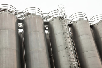 Metal tower silos of the industrial plant © rootstocks