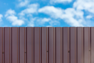 Fence made of metal and blue sky background