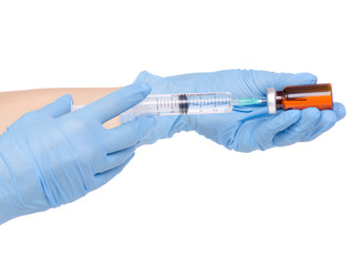 Syringe and medical ampoule in hand medical gloves