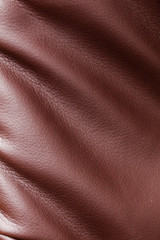 Brown leather material as an abstract background