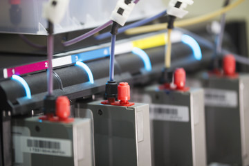 Ink cartridges inside modern professional printing machine