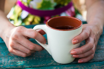 Woman holding a cup of tea