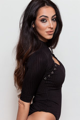 Obraz premium Gorgeous woman portrait wearing black leotard and looking at camera