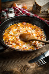 Scrambled eggs with sausage.