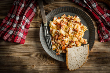 Scrambled eggs with sausage.