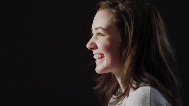 Side view of a woman laughing