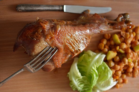 roast turkey leg on a wooden board