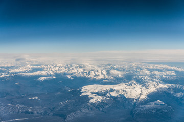 Mountain range in Caucasus mountains with snowy tops.