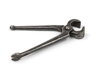 Old used iron nippers, for pulling and biting off nails and cutting metal close-up. Isolated on white background.