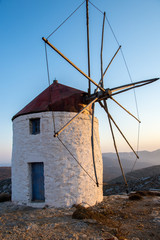 Fototapeta na wymiar A windmill at the top of the Chora of Amorgos