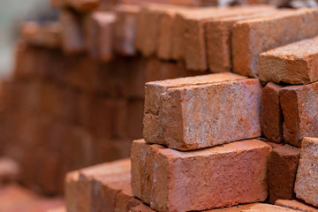 Red bricks on building. On blurred background