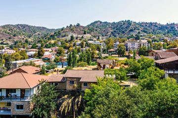Fototapeta premium Daylight view from above to city buildings and Troodos Mountains