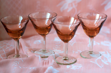brown glasses on pink background