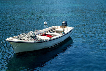 Fototapeta na wymiar Fishing boat at sea.Boat at beautiful blue water