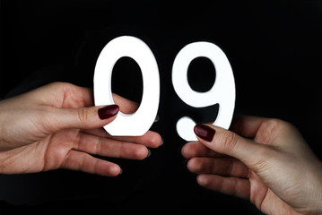 On the palms the number zero and nine.