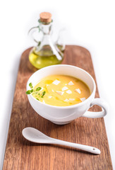 Pumpkin soup on a wooden table