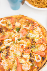 Delicious pizza with seafood.