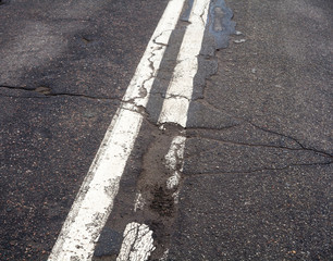 Naklejka premium Double white marking line on the old road