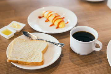 Fresh breakfast table in the hotel. coffee, bread and omelet.