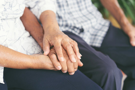 Elderly Couples Are Holding Hands, Concept Of Take Care Together.