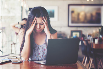 Asian woman frustrated on his work and out of control.