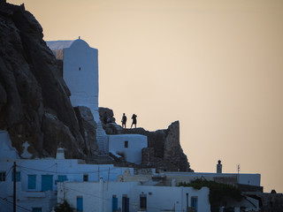 Amorgos, Greece-August 3, 2017.A girl is photographing the beautiful view from the castle of...