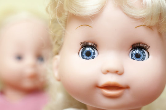 The faces of the dolls.