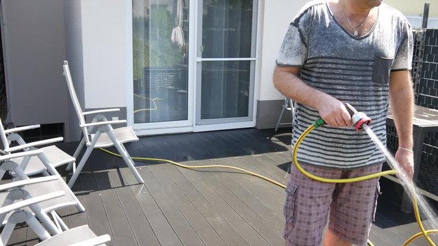 Outdoor cement floor cleaning with high pressure water jet