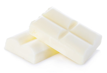 White chocolate pieces close-up isolated on a white background.