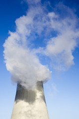 Cooling tower with water vapor over it